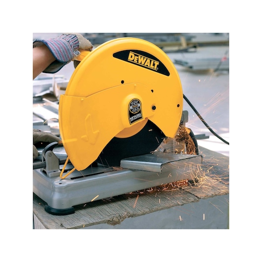Chop Saw with QUIK-CHANGE™ Keyless Blade Change System being used to cut a piece of metal