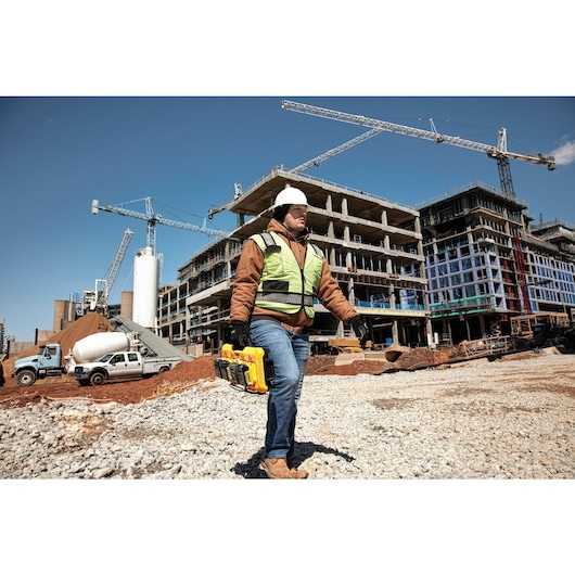 Multiport fast charger being carried by a construction worker