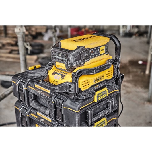 Powershift 554WH battery and Powershift charger DCBPSC0550 stacked on top of ToughSystem storage