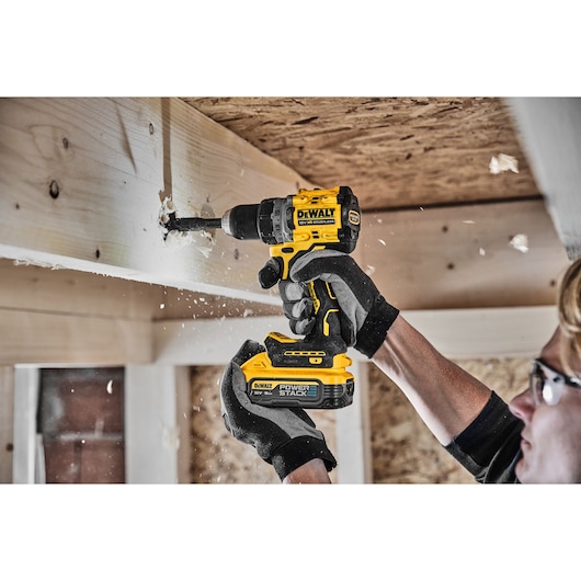XR Brushless Drill Driver right side view with LED light drilling wooden beam