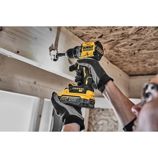 XR Brushless Drill Driver 3/4 right side view with LED light drilling wooden beam