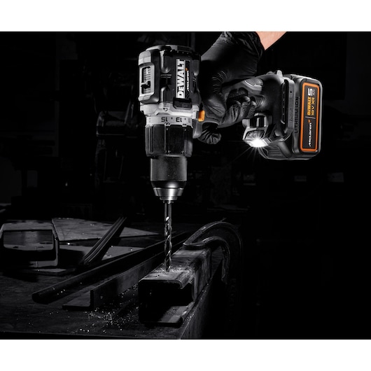 DEWALT/McLaren Drill Driver drilling metal with light on