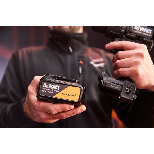 4Ah battery being connected to the DEWALT x McLaren F1 Team 18V XR Special Edition Hammer Drill Driver