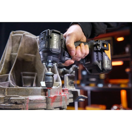 DEWALT x McLaren F1 Team 18V XR Special Edition Impact Driver with 5Ah battery in application