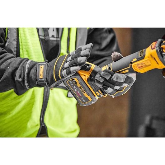 Flexvolt battery being connected to Brushless 18V XR 125mm cordless angle grinder