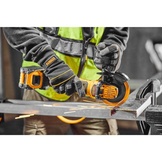 Close view of Brushless 18V XR 125mm cordless angle grinder cutting metal