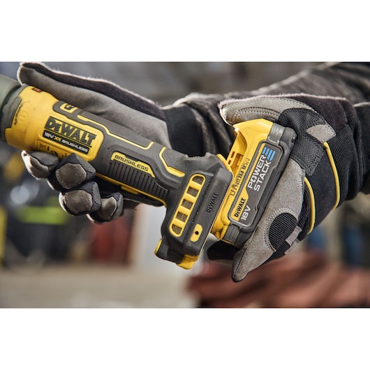 Powerstack battery being attached to the DEWALT 18V XR Compact Inline Grinder