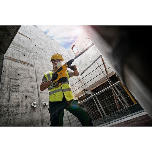 Brushless SDS MAX combination rotary hammer being used by a person