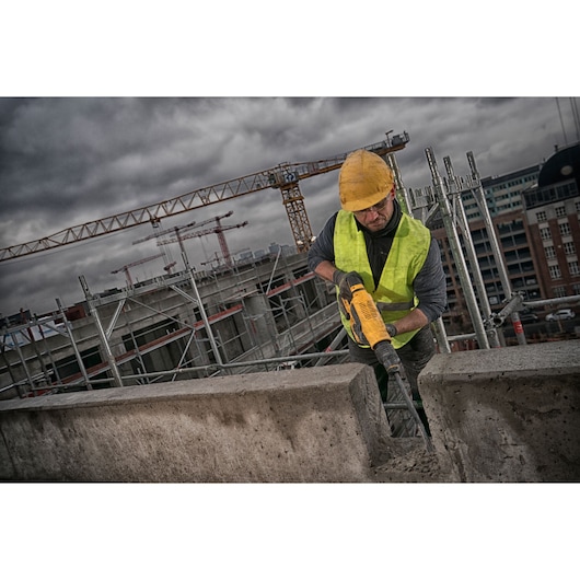 Brushless SDS MAX combination rotary hammer being used by a person