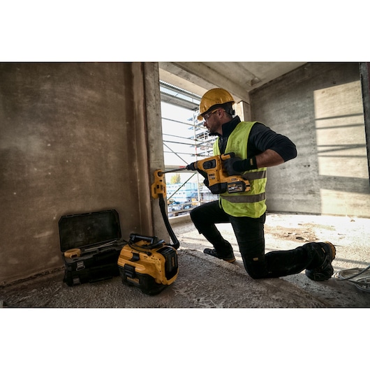 Brushless SDS MAX combination rotary hammer being used by a person