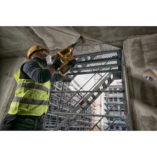 Brushless SDS MAX combination rotary hammer being used by a person