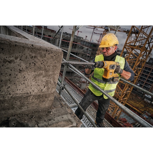 Brushless SDS MAX combination rotary hammer being used by a person