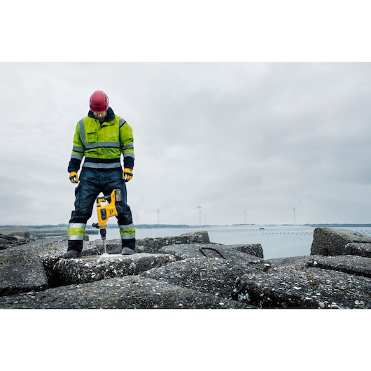 Brushless SDS MAX combination rotary hammer being used by a person