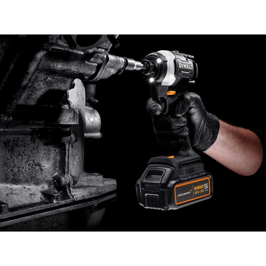 DEWALT/McLaren Drill Driver drilling metal with light on