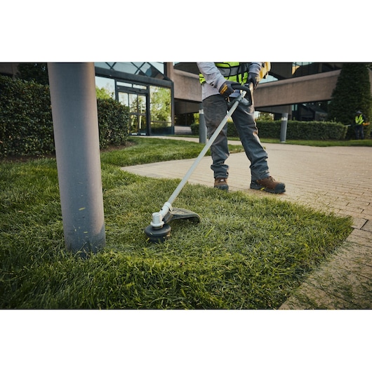 The DEWALT 54V XR FLEXVOLT String Trimmer Lite cutting grass