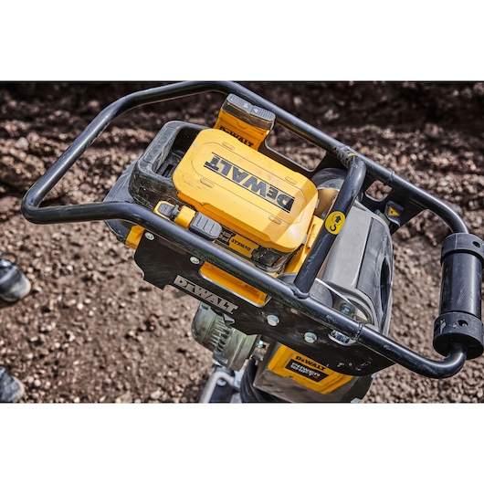 Close view of Powershift Battery DCBPS0554 attached to Powershift Rammer on a construction site