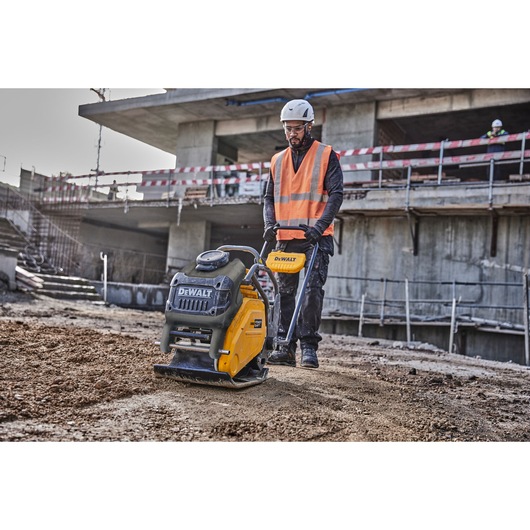 Worker uses Powershift Plate Compactor to compact the ground on a construction site