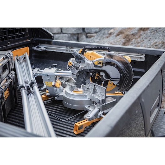 The DEWALT 18V XR 305mm Slide Mitre Saw in back of works truck
