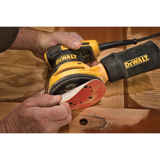 5 inch variable speed random orbit sander being set up for use.