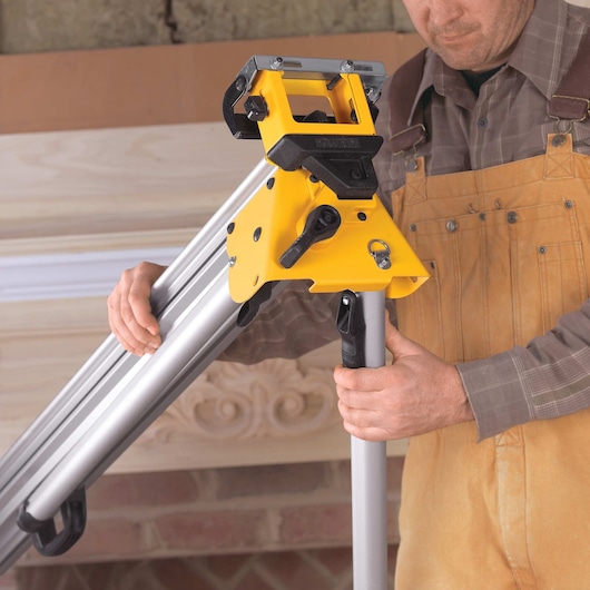 12 inch double bevel sliding compound miter saw being set up by a worker for use.