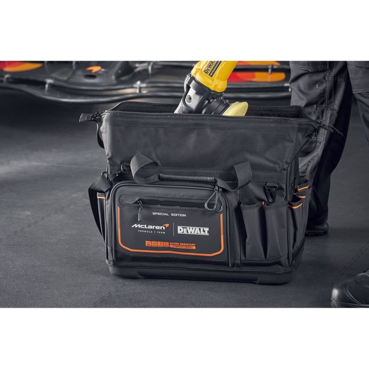 DEWALT McLaren tool bag with multiple pockets for storing tools, designed for heavy-duty work.