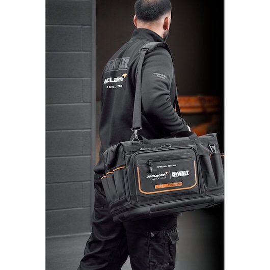 DEWALT McLaren tool bag with shoulder strap for carrying tools, organized storage, durable materials.