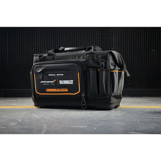 DeWALT McLaren tool bag with multiple pockets for storage and water-resistant compartments.