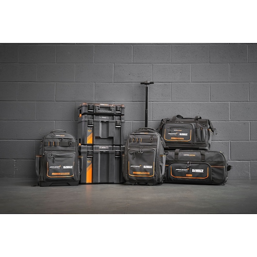 A group shot of the DEWALT/McLaren 2025 storage range featuring a backpack with handle and wheels (DWST60101-9), tool bag (DWST60104-9), backpack (DWST60122-1), TSTAK 3-in-1 workshop bundle (DWST60452-1) and duffle bag (DWST83522-9).