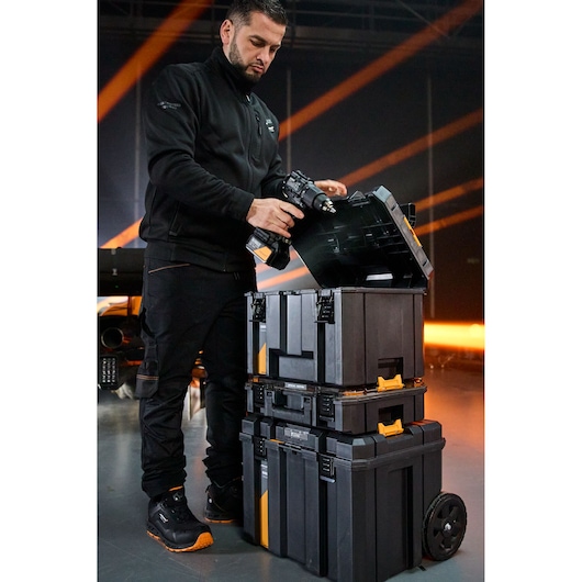 Photography storage cases stacked, wheeled with compartments for equipment protection and transport.
