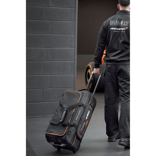 DEWALT rolling duffel bag with side pockets for travel and convenient storage.