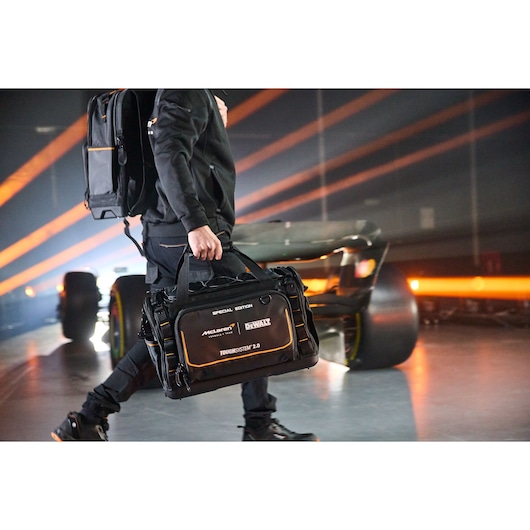 DEWALT ToughSystem 2.0 tool bag special edition carried by a person, designed for tool transport and storage.